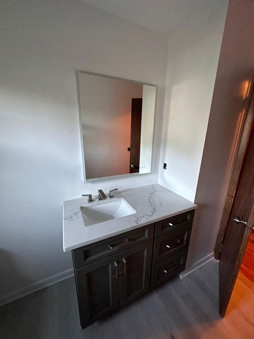 Edison bathroom remodeling with shower enclosure