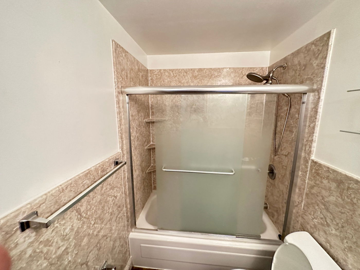 Livingston bathroom remodeling with marble-look tile — before