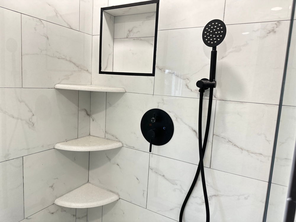 Livingston bathroom remodeling with marble-look tile — gallery image 2