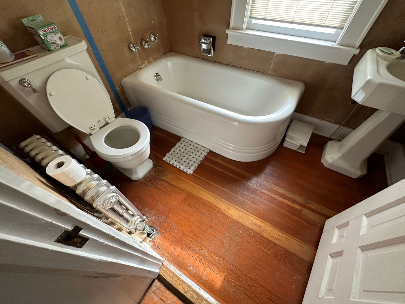 Millington bathroom renovation with barn door storage — before